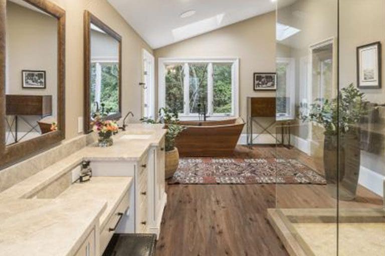 Bathroom with large soaking tub and separate shower.