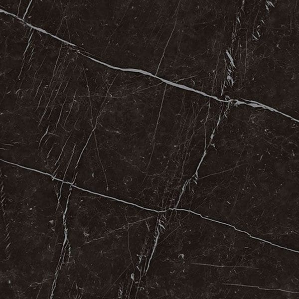 Close-up of a dark porcelain slab with intricate white veining and several cracks.