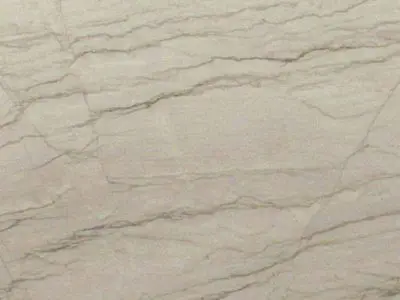 Close-up of a beige natural stone surface with subtle veins and speckles.