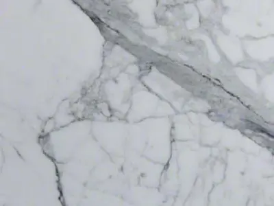 Close-up of a natural stone surface with gray veins.