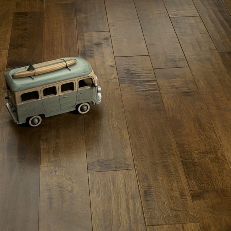 A toy van on a dark carpet flooring with visible textures.