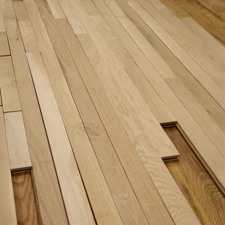 Close-up of light wooden floorboards with varying lengths and natural wood grain detail, complemented by carpet flooring services.