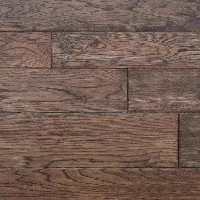 Close-up of a dark brown wooden floor with visible wood grain and plank details, perfect for our carpet flooring services.