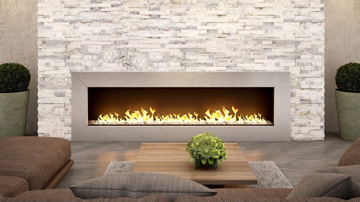 Modern living room with a long horizontal fireplace, brown sofas, and decorative plants against a natural stone countertop wall.