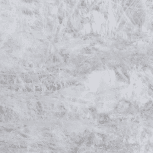 Close-up of Cristallo quartzite slab showing translucent white crystal patterns and natural gold veining