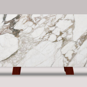 Full slab of Calacatta Vagli marble featuring a white background with bold gray veining and dramatic natural stone movement.