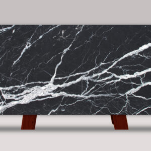 Full slab of Calacatta Black marble featuring a deep black background with striking white veining and dramatic natural stone movement.
