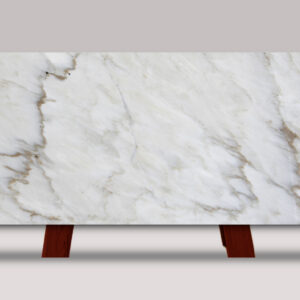 Full slab of Crema Delicato marble featuring a soft white and cream background with subtle gray veining and warm natural stone accents.