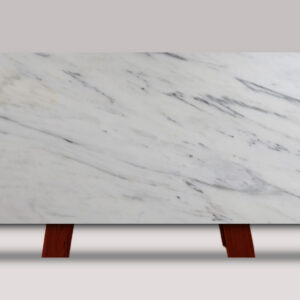 Full slab of Royal Danby marble featuring a bright white background with soft gray veining and elegant natural stone movement.