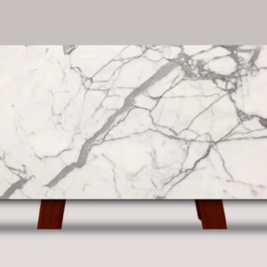 Full slab of Statuario Venato marble featuring a bright white background with flowing gray veining and natural stone movement.