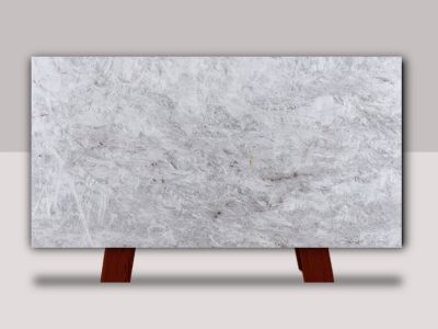 Cristallo quartzite slab with soft white and gray natural veining displayed for professional granite and quartzite installation in Kansas City