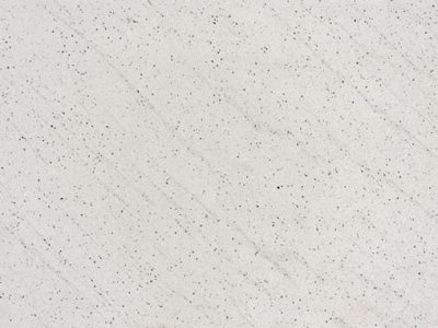 Close-up of a light, speckled granite surface.