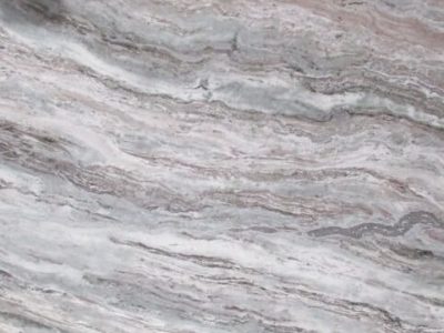 Close-up of textured gray and white layered stone surface.