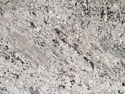 Close-up of a textured gray and black granite surface.