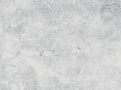 Close-up of Super White marble featuring soft gray veining, layered movement, and natural stone variation across a light surface.
