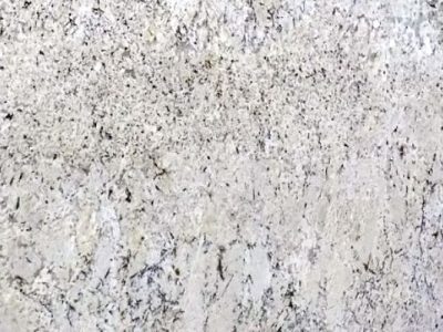 Close-up of white textured granite with black and gray speckles.
