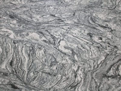 Close-up of textured gray marble with swirling white and dark veins.