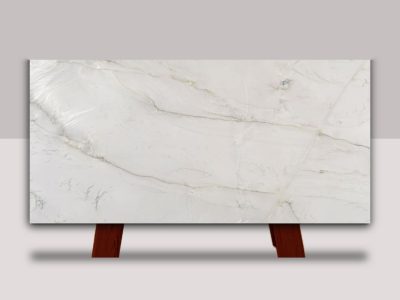 Bianco Superiore Quartzite slab featuring a soft white background with flowing gray veining and subtle natural movement.