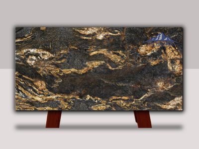 Polished granite slab with rich black and gold veining, displayed on wooden stands.