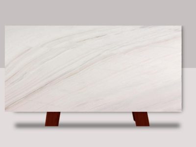 Full slab of Calacatta Lasa marble featuring a bright white background with flowing gray veining and natural stone variation.
