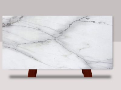 Full slab of Calacatta Lincoln marble featuring a bright white background with elegant gray veining and natural stone movement.