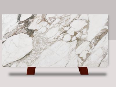 Full slab of Calacatta Vagli marble featuring a white background with bold gray veining and dramatic natural stone movement.