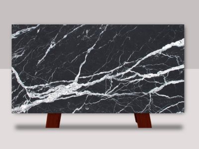 Full slab of Calacatta Black marble featuring a deep black background with striking white veining and dramatic natural stone movement.