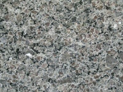Close-up of a textured granite surface with gray, black, and white patterns.