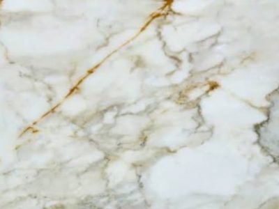 Close-up of Calacatta Gold marble featuring a white background with soft gray and warm gold veining throughout the natural stone surface.