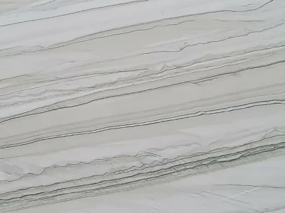 Close-up of Chantilly Quartzite featuring flowing horizontal layers of soft gray, ivory, and charcoal veining that create a striking natural linear pattern.