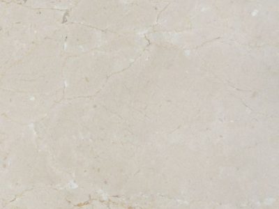 Close-up of Crema Marfil marble showcasing warm beige tones, subtle veining, and natural stone texture.