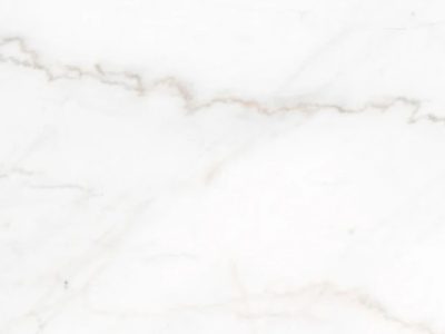Close-up of Imperial Danby marble featuring a soft white background with subtle gray veining and delicate natural stone variation.