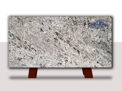 A large slab of white and gray granite with black speckles.