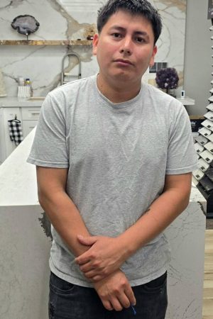 Ferdin, countertop fabricator at AnyTopShop, standing in the stone showroom and fabrication design center serving homeowners throughout the Kansas City metro area.