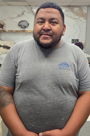 Dave, countertop fabricator at AnyTopShop, standing in the showroom and fabrication center specializing in custom granite, quartz, and quartzite countertops in the Kansas City metro area.
