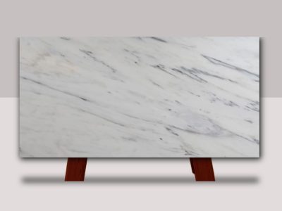 Full slab of Royal Danby marble featuring a bright white background with soft gray veining and elegant natural stone movement.