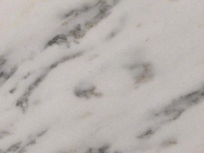 Close-up of Royal Danby marble showcasing a white background with soft gray veining and natural stone detail.