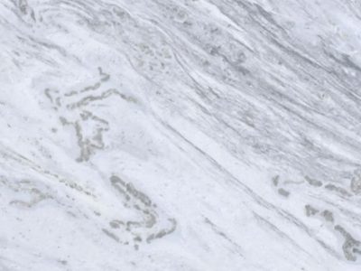 Close-up of Shadow Storm marble featuring layered gray veining, soft natural movement, and subtle variation across a white marble surface.