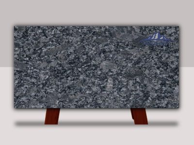 A polished granite slab displayed on wooden stands.