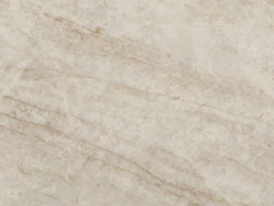 Close-up of Taj Exotica Quartz showcasing soft ivory and beige tones with layered texture and subtle natural stone-inspired movement.