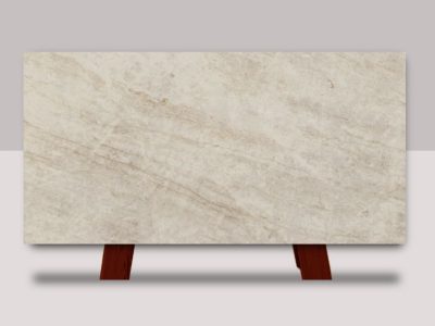 Taj Exotica Quartz slab featuring soft ivory and warm beige tones with layered stone-like texture and subtle natural movement throughout the surface.