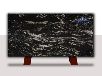 Polished black and gold granite slab on a wooden stand.
